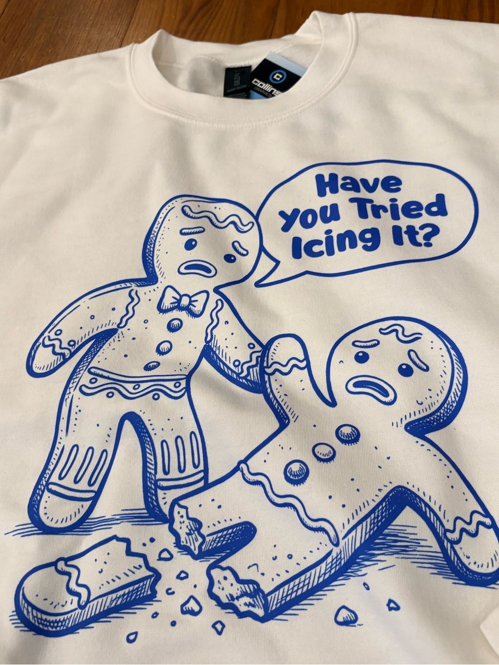 Gildan White Crewneck Sweatshirt with Blue Gingerbread Graphic - Picture 2 of 3